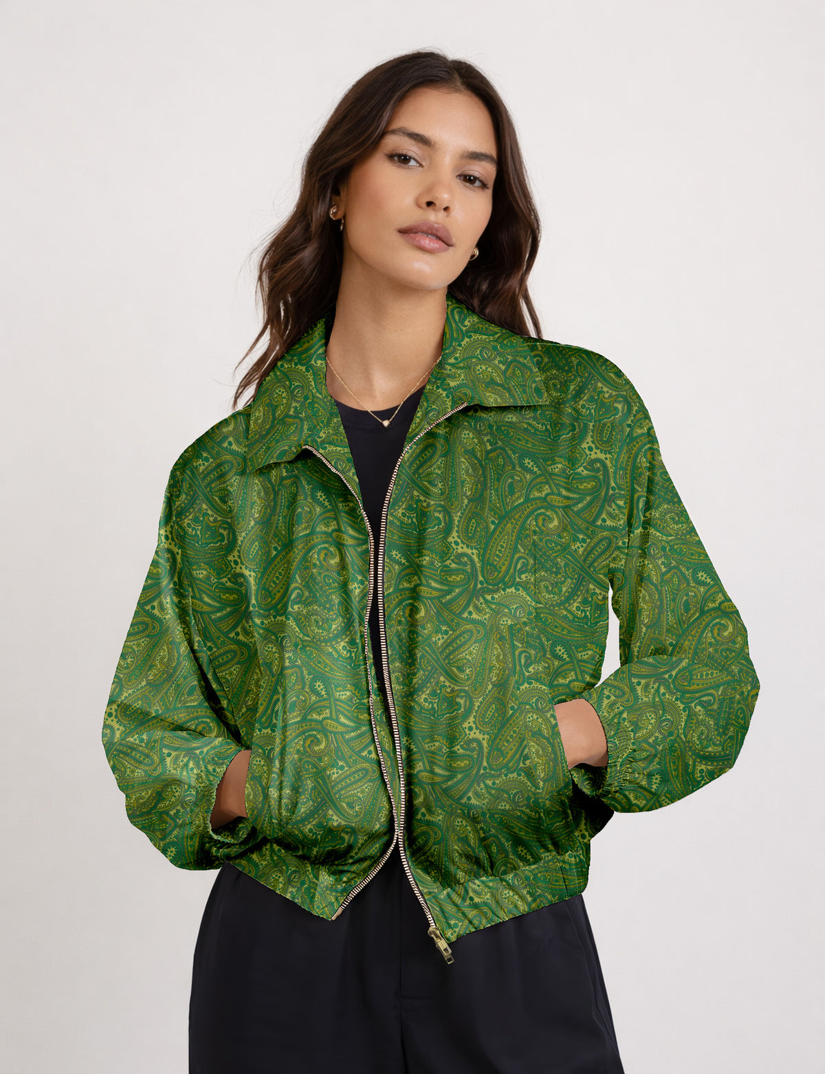 Woman wearing a yellow floral bomber jacket with front zipper, elastic cuffs, and side pockets, shown from front view
