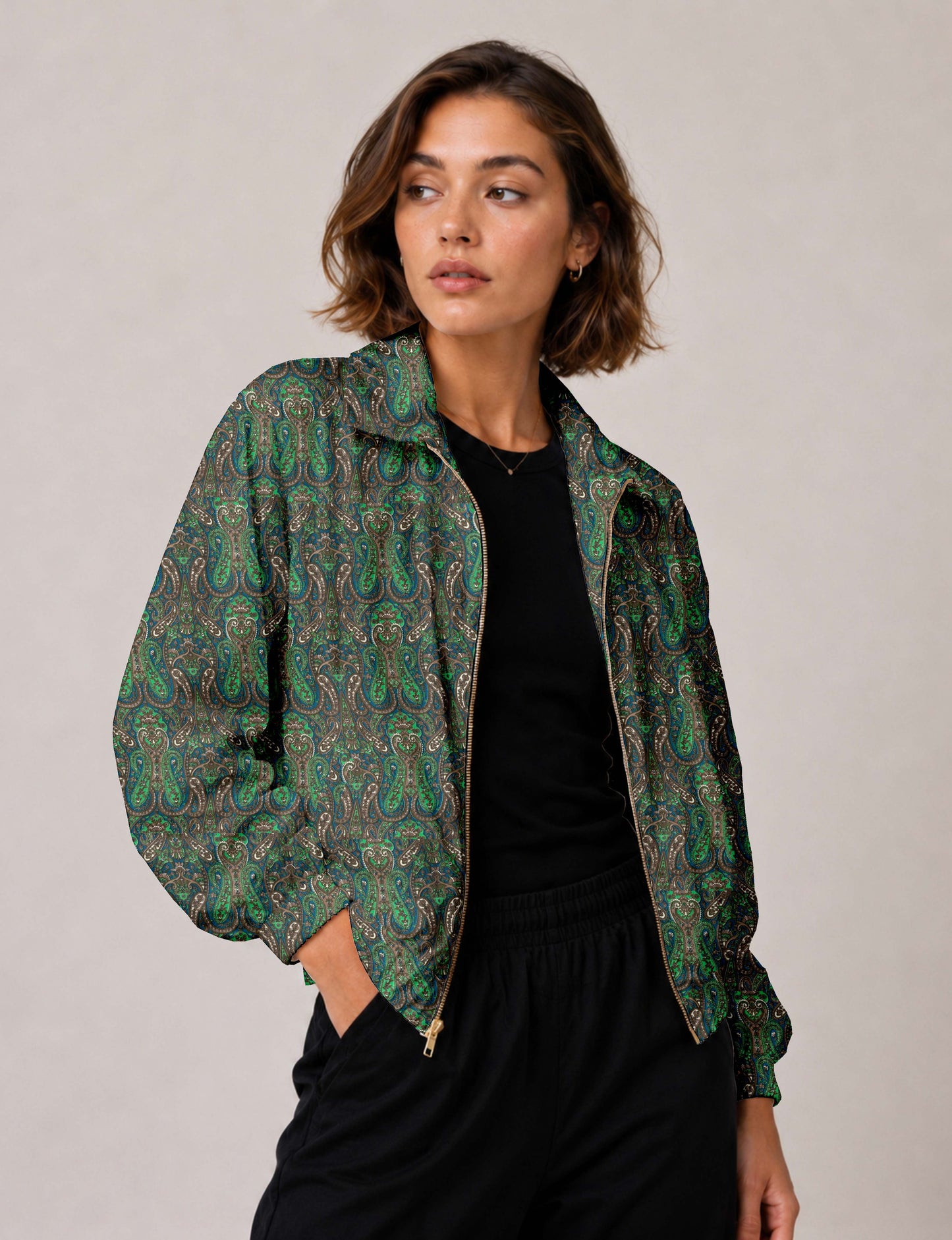 Brown floral bomber jacket with front zipper, elastic cuffs and hem, hanging on white hanger, red floral inner lining visible