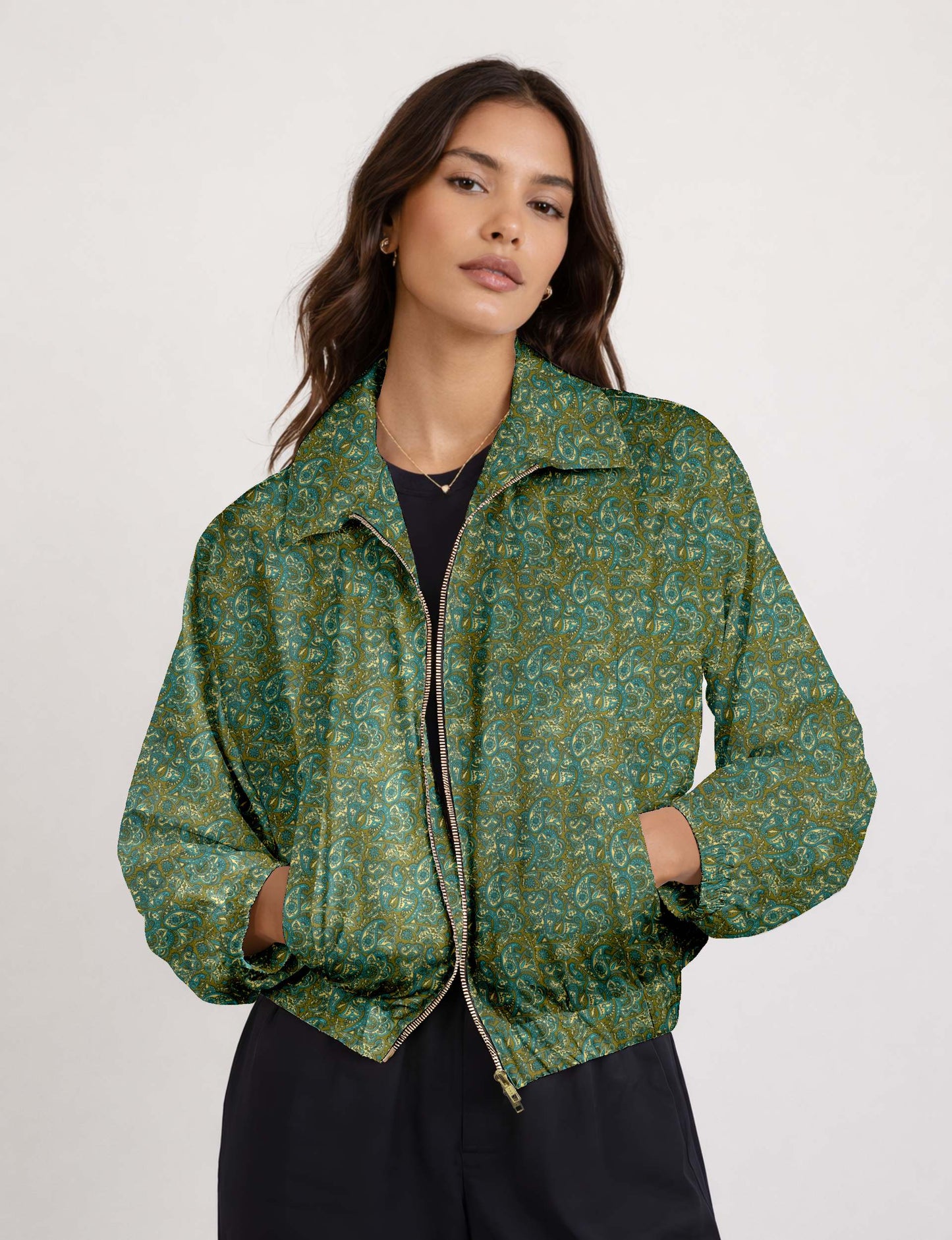 Woman wearing a yellow floral bomber jacket with front zipper, elastic cuffs, and side pockets, shown from front view