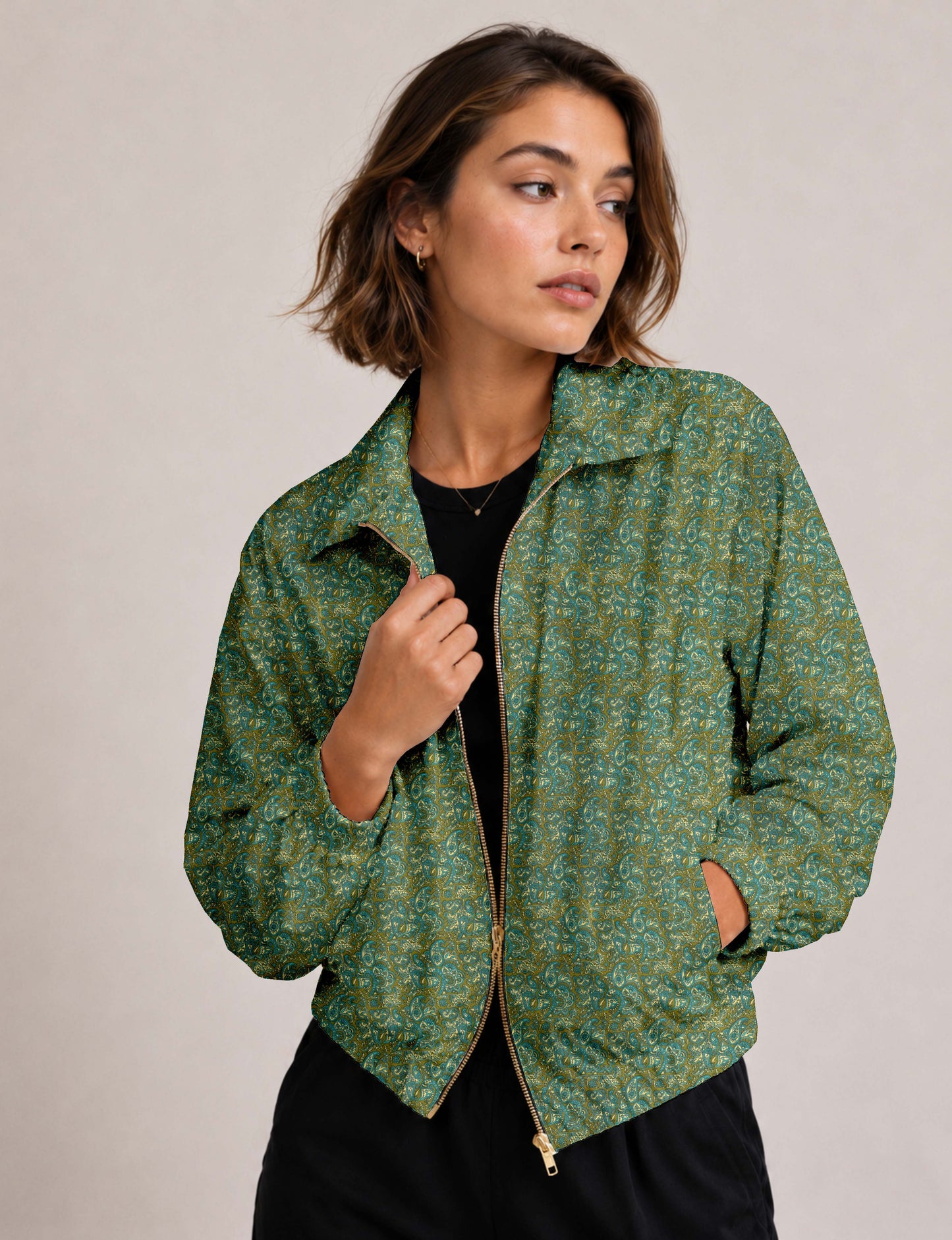 Brown floral bomber jacket with front zipper, elastic cuffs and hem, hanging on white hanger, red floral inner lining visible