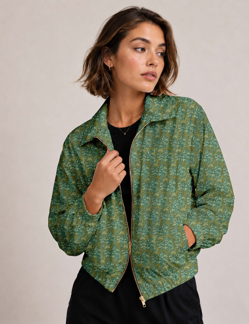 Brown floral bomber jacket with front zipper, elastic cuffs and hem, hanging on white hanger, red floral inner lining visible
