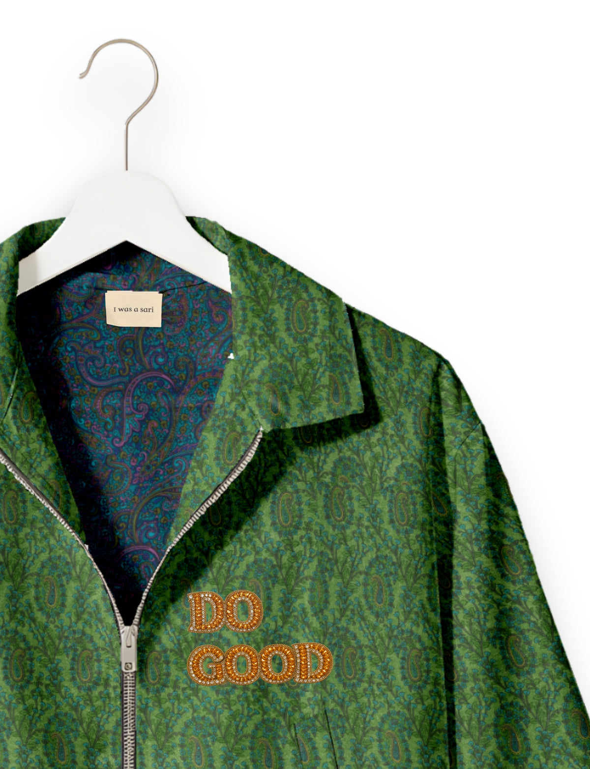 Gold cropped DO GOOD bomber jacket featuring hand-embroidered lettering on the left chest, contrasting inner lining and two functional pockets.