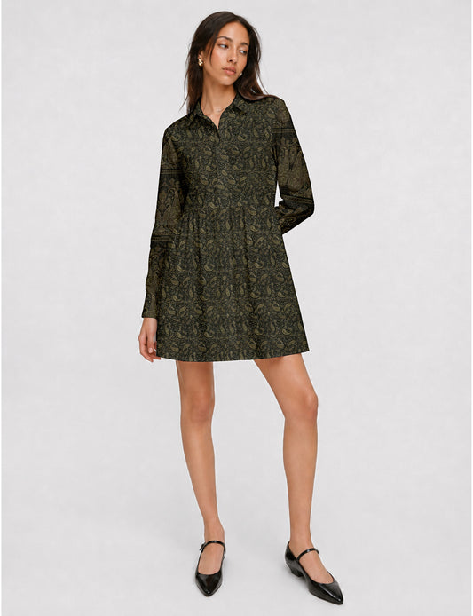 Short shirt dress with a relaxed A-line silhouette, point collar, partial button placket, gathered waist, side pockets, and full-length cuffed sleeves.