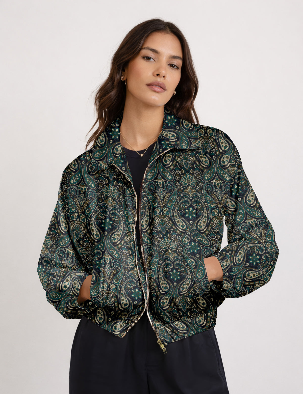 Woman wearing a yellow floral bomber jacket with front zipper, elastic cuffs, and side pockets, shown from front view