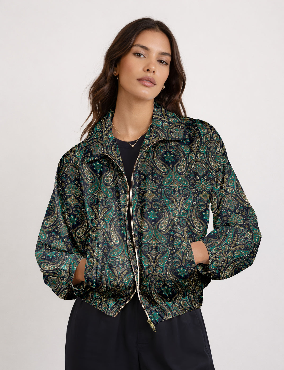 Brown floral bomber jacket with front zipper, elastic cuffs and hem, hanging on white hanger, red floral inner lining visible