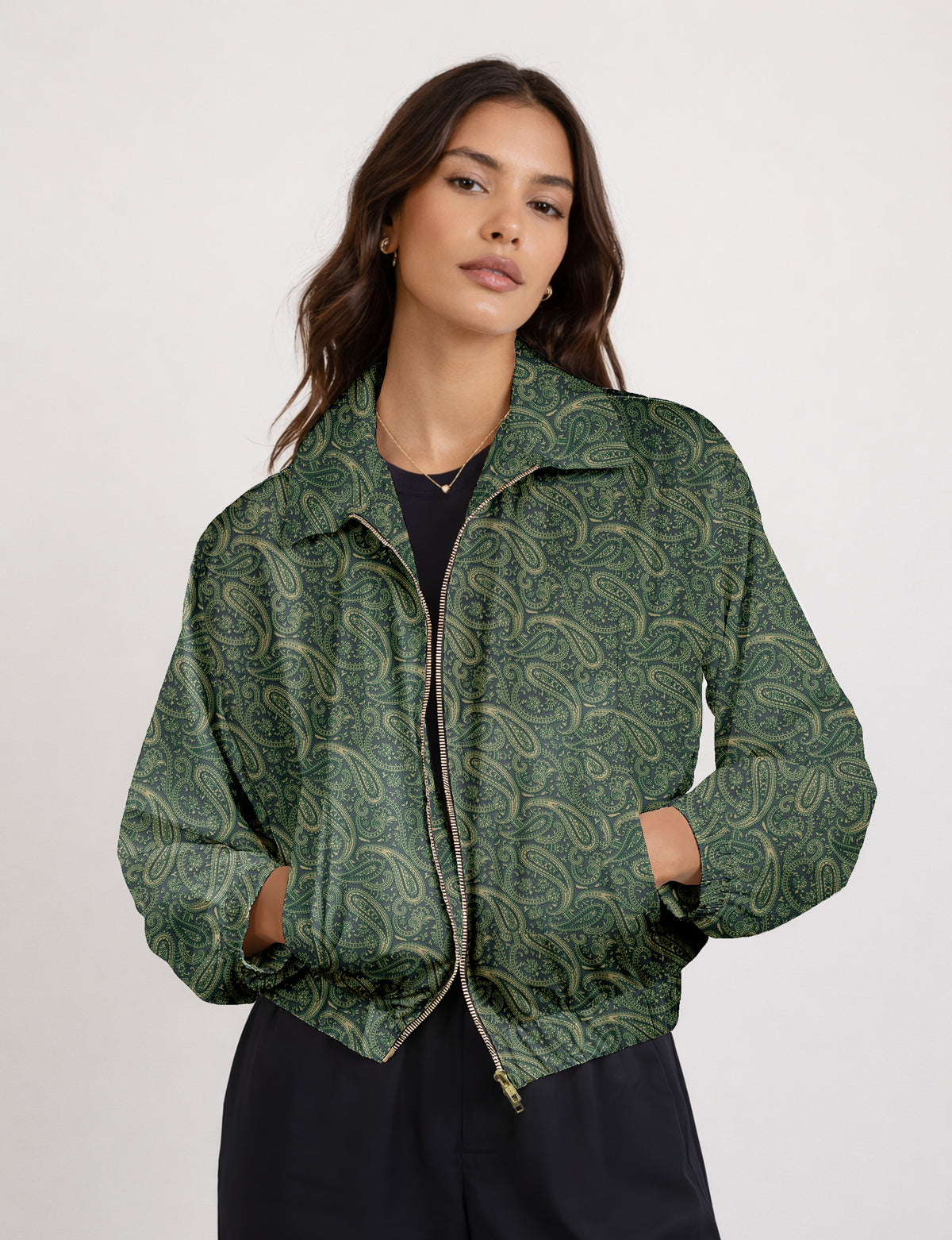 Brown floral bomber jacket with front zipper, elastic cuffs and hem, hanging on white hanger, red floral inner lining visible