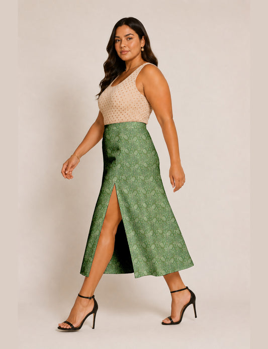 Woman wearing a yellow and black micro patterned A-line skirt with front slit, paired with beige sleeveless top and black
