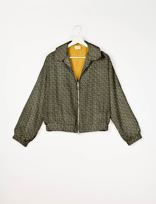 Upcycled Bomber Jacket made from recycled sari materials, featuring a cute cropped shape, elasticated hem and cuffs, and contrast sari print lining. Sustainable apparel promoting eco-friendly fashion and ethical clothing.