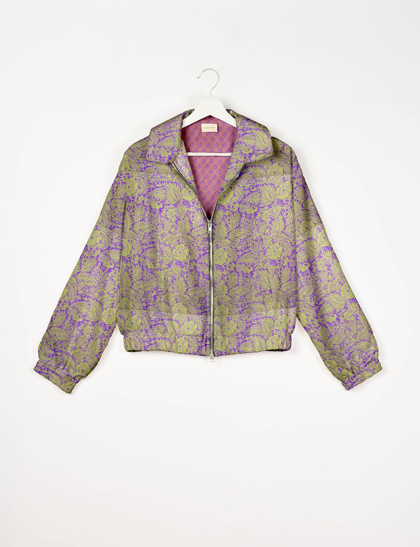 Upcycled Bomber Jacket made from recycled sari materials, featuring a cute cropped shape, elasticated hem and cuffs, and contrast sari print lining. Sustainable apparel promoting eco-friendly fashion and ethical clothing.