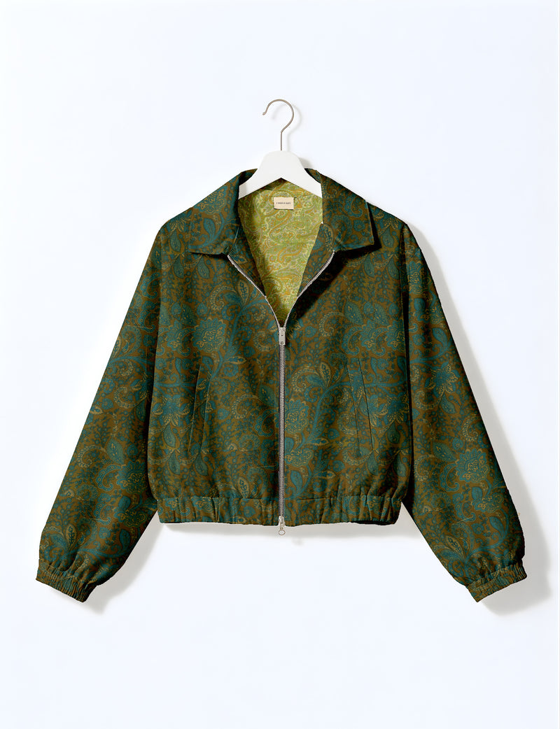 Brown floral bomber jacket with front zipper, elastic cuffs and hem, hanging on white hanger, red floral inner lining visible