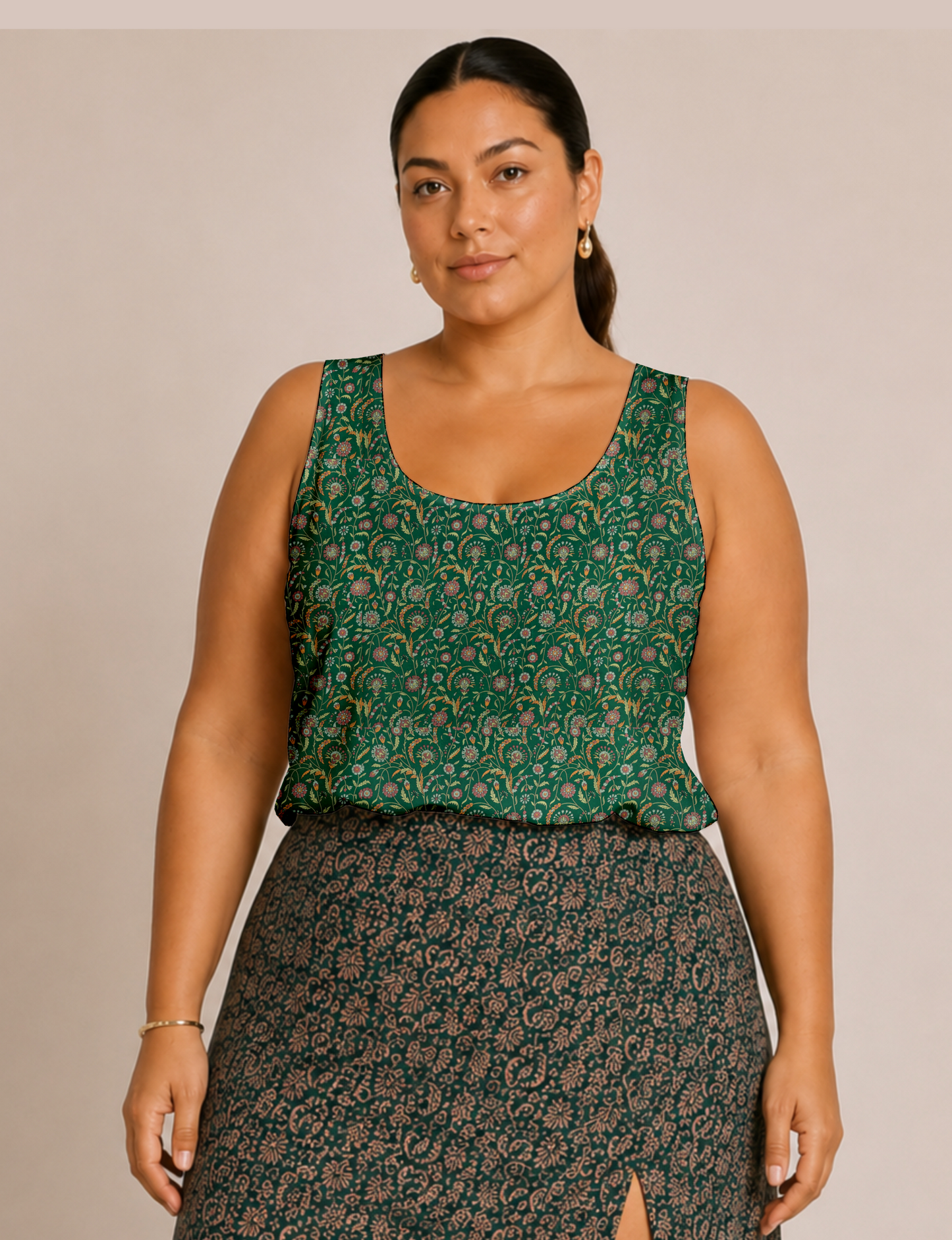 Women's sleeveless blouse with a relaxed straight fit, wide scoop neckline, deep scoop back, and hip-length silhouette.