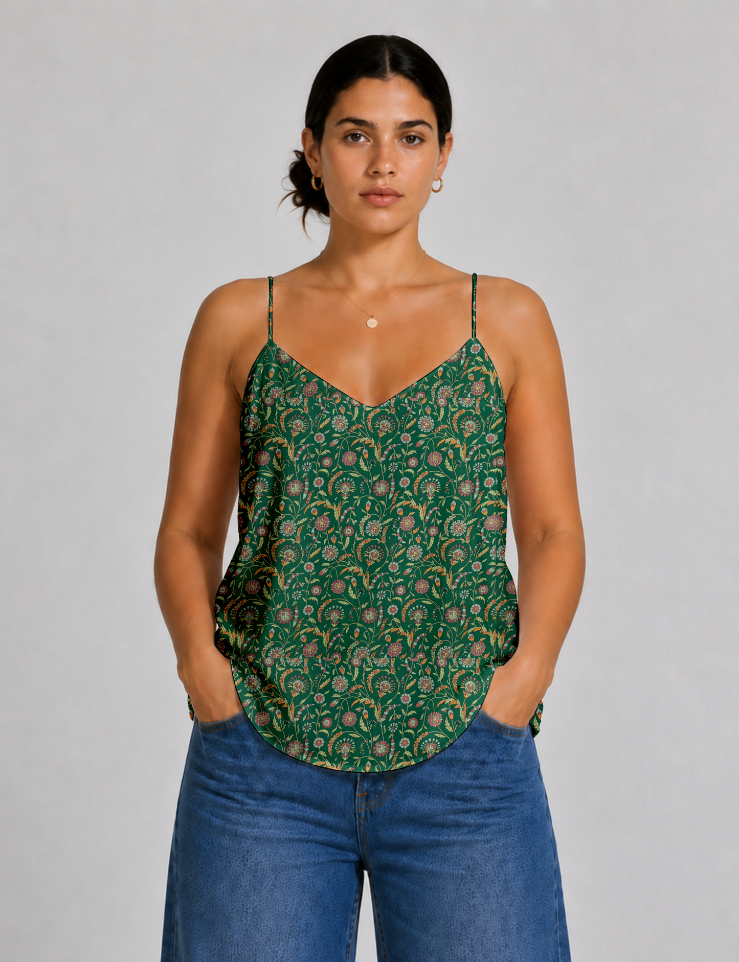 Women's sleeveless slip top with a relaxed straight fit, soft V-neckline, deep V-back, and delicate spaghetti straps.