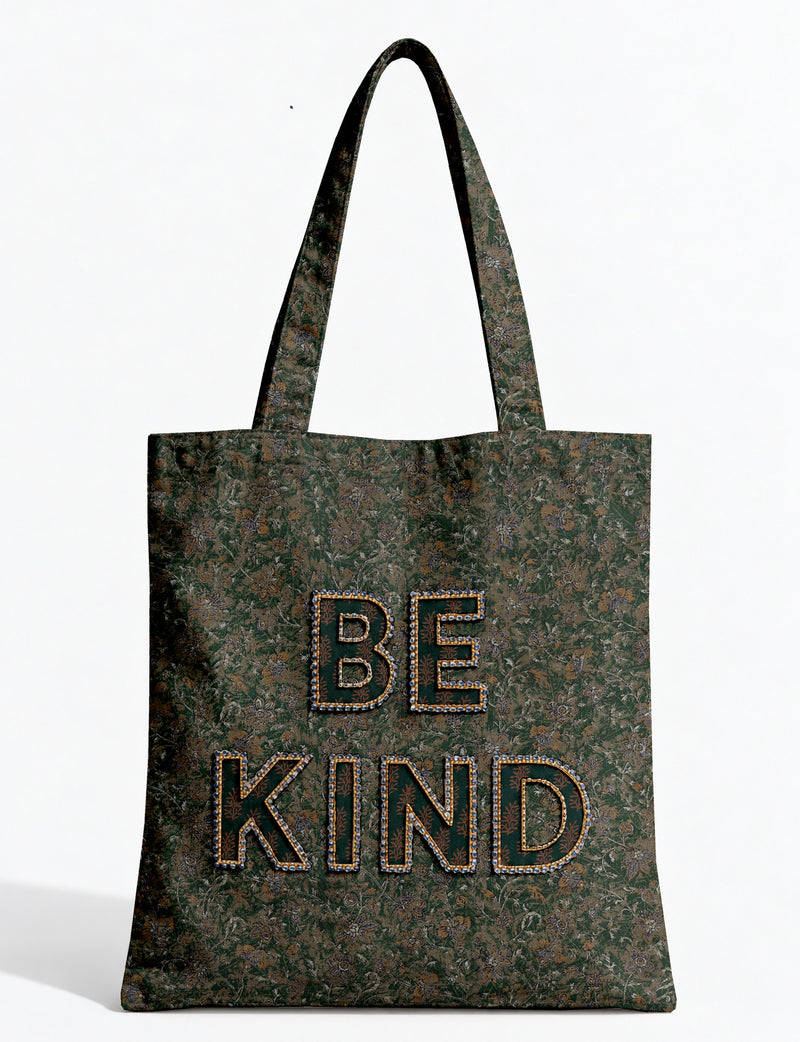Be Kind tote bag with contrast sari fabric appliqué lettering, double shoulder straps, and front slip pocket.