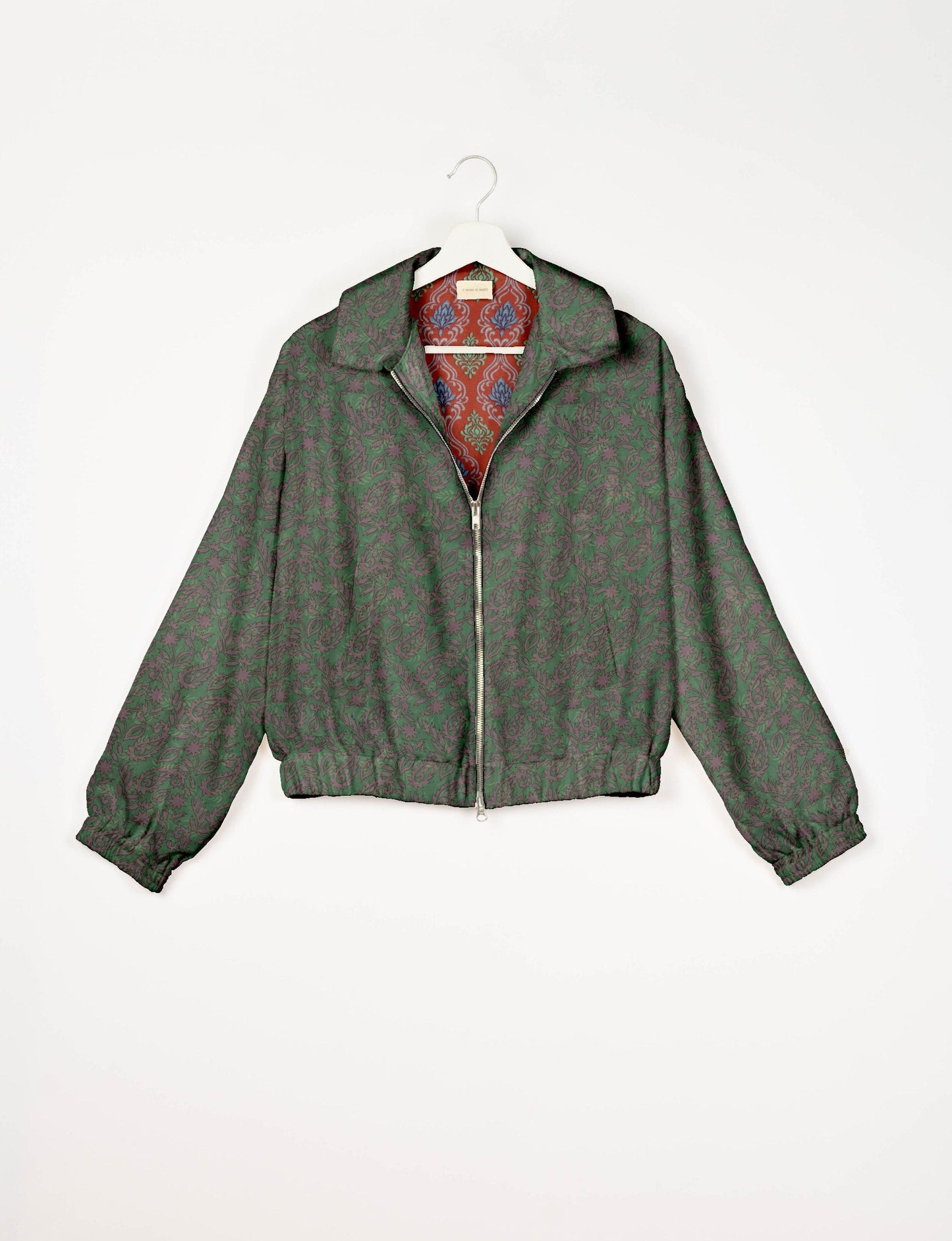 Upcycled Bomber Jacket made from recycled sari materials, featuring a cute cropped shape, elasticated hem and cuffs, and contrast sari print lining. Sustainable apparel promoting eco-friendly fashion and ethical clothing.