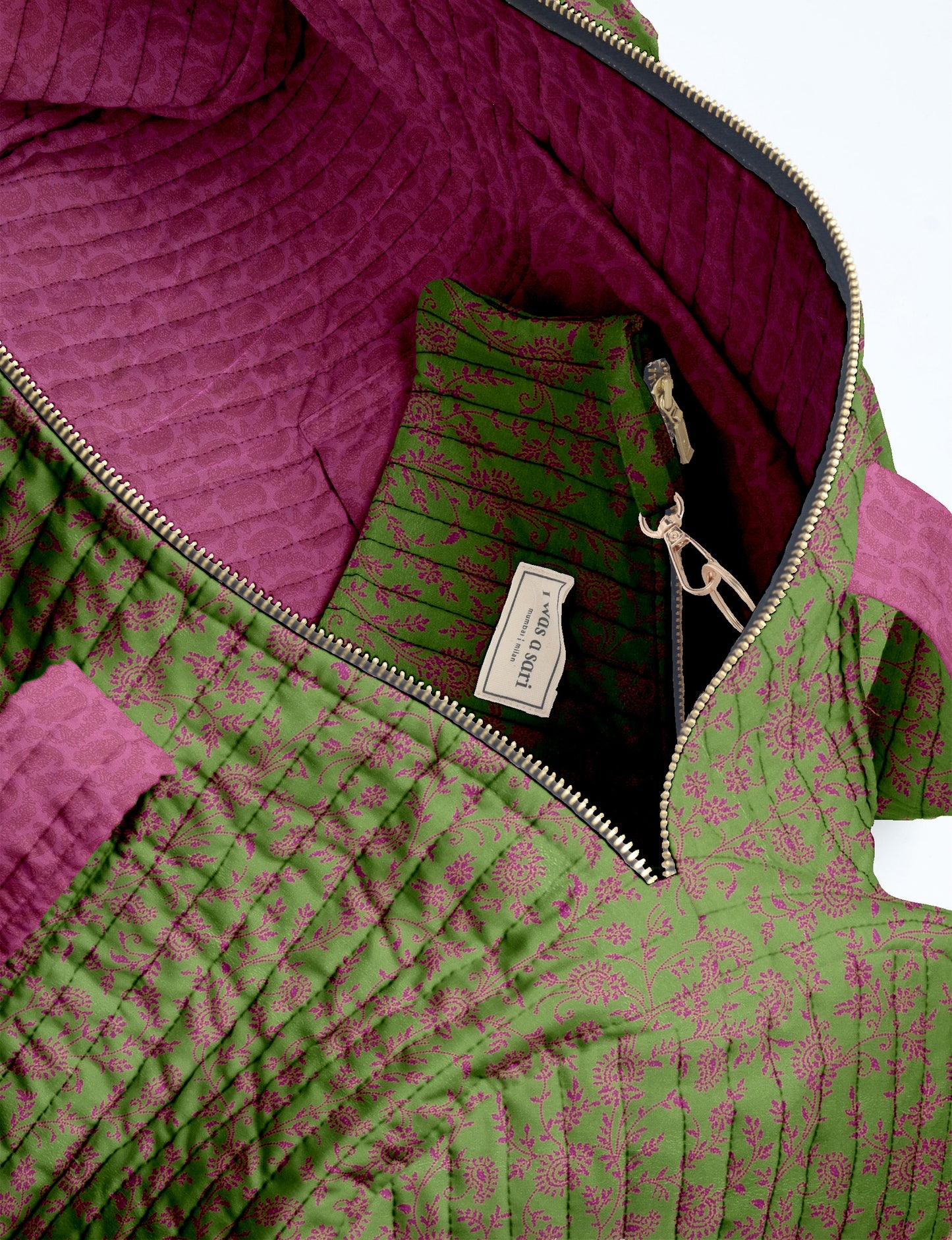 Brown paisley quilted bowling bag with front zipper pocket, held by person wearing white shirt and light blue jeans