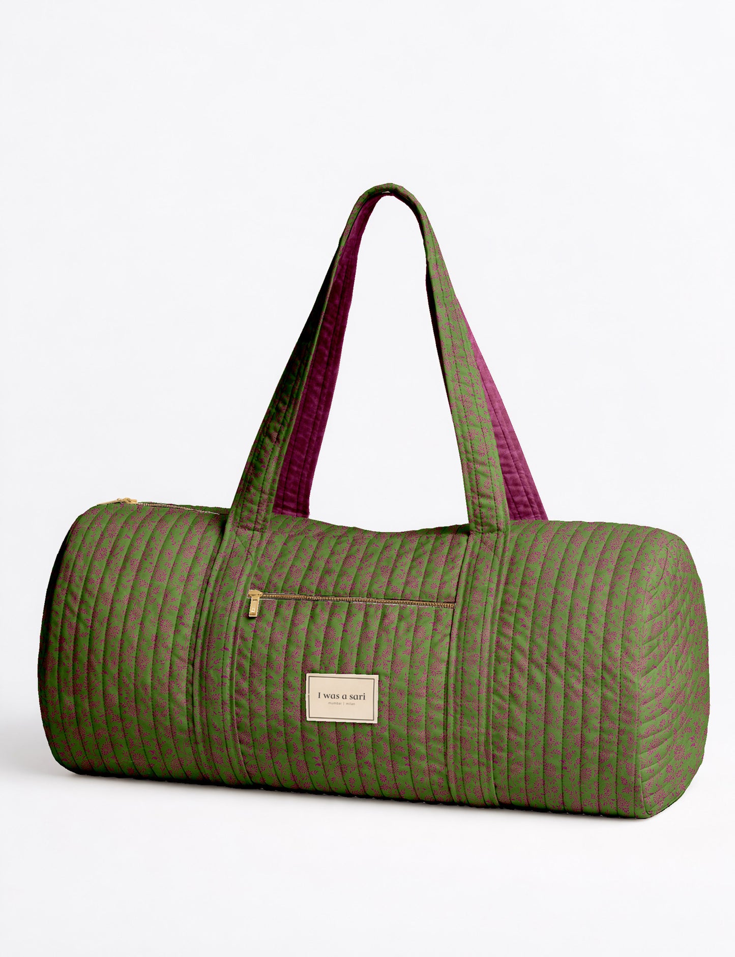 Quilted brown paisley bowling bag with gold zipper, floral interior lining, and interior key clip with label inside pocket