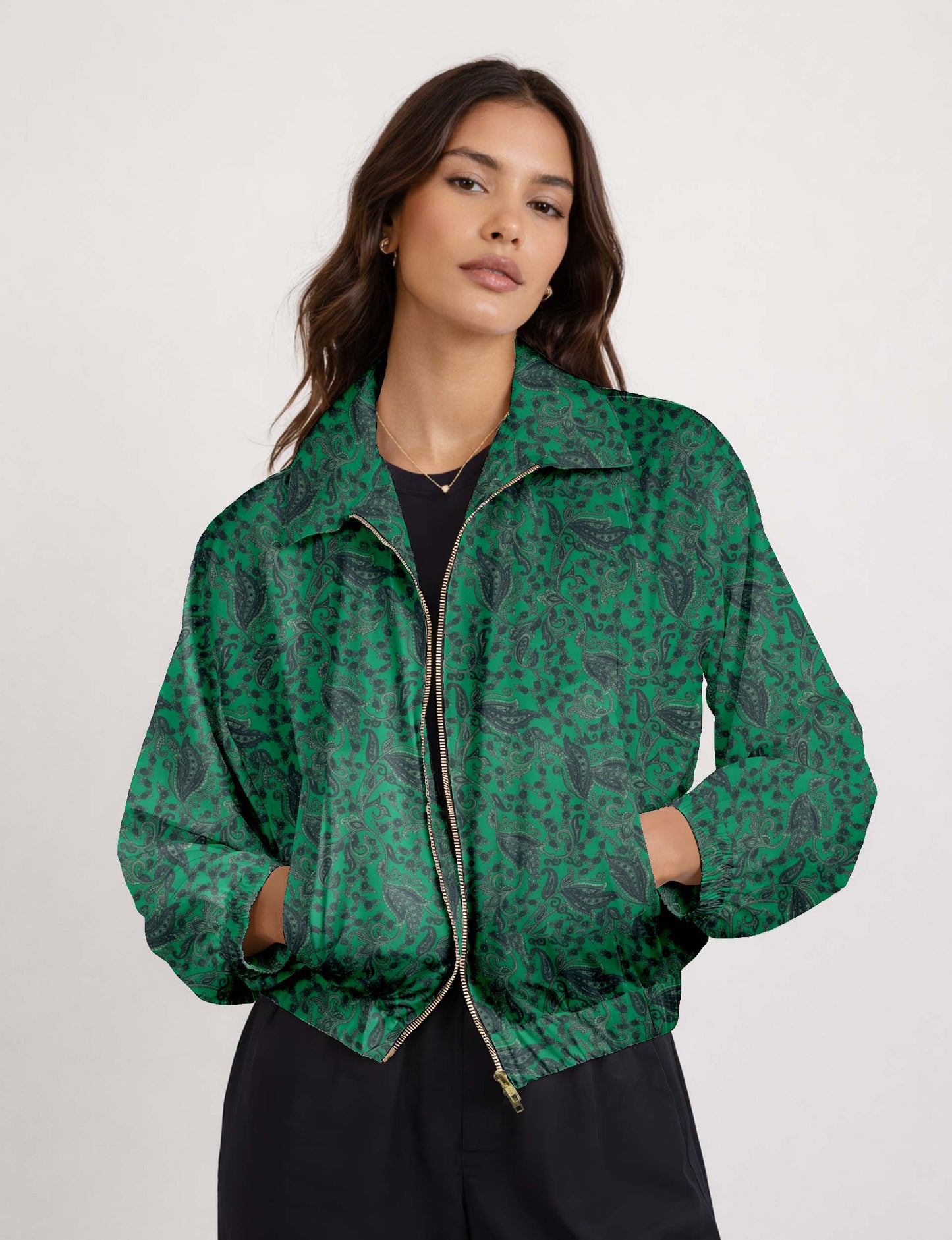 Brown floral bomber jacket with front zipper, elastic cuffs and hem, hanging on white hanger, red floral inner lining visible