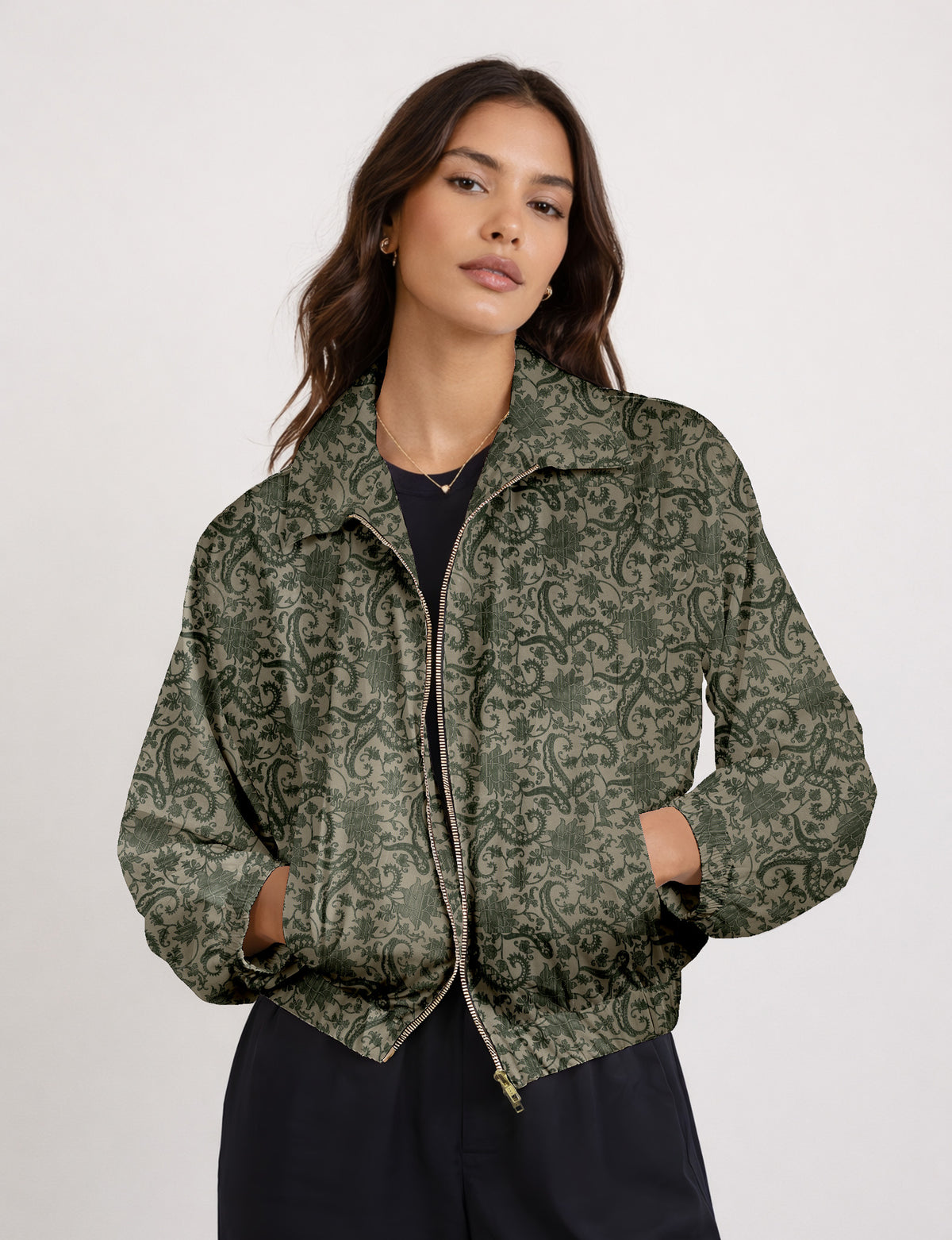 Brown floral bomber jacket with front zipper, elastic cuffs and hem, hanging on white hanger, red floral inner lining visible