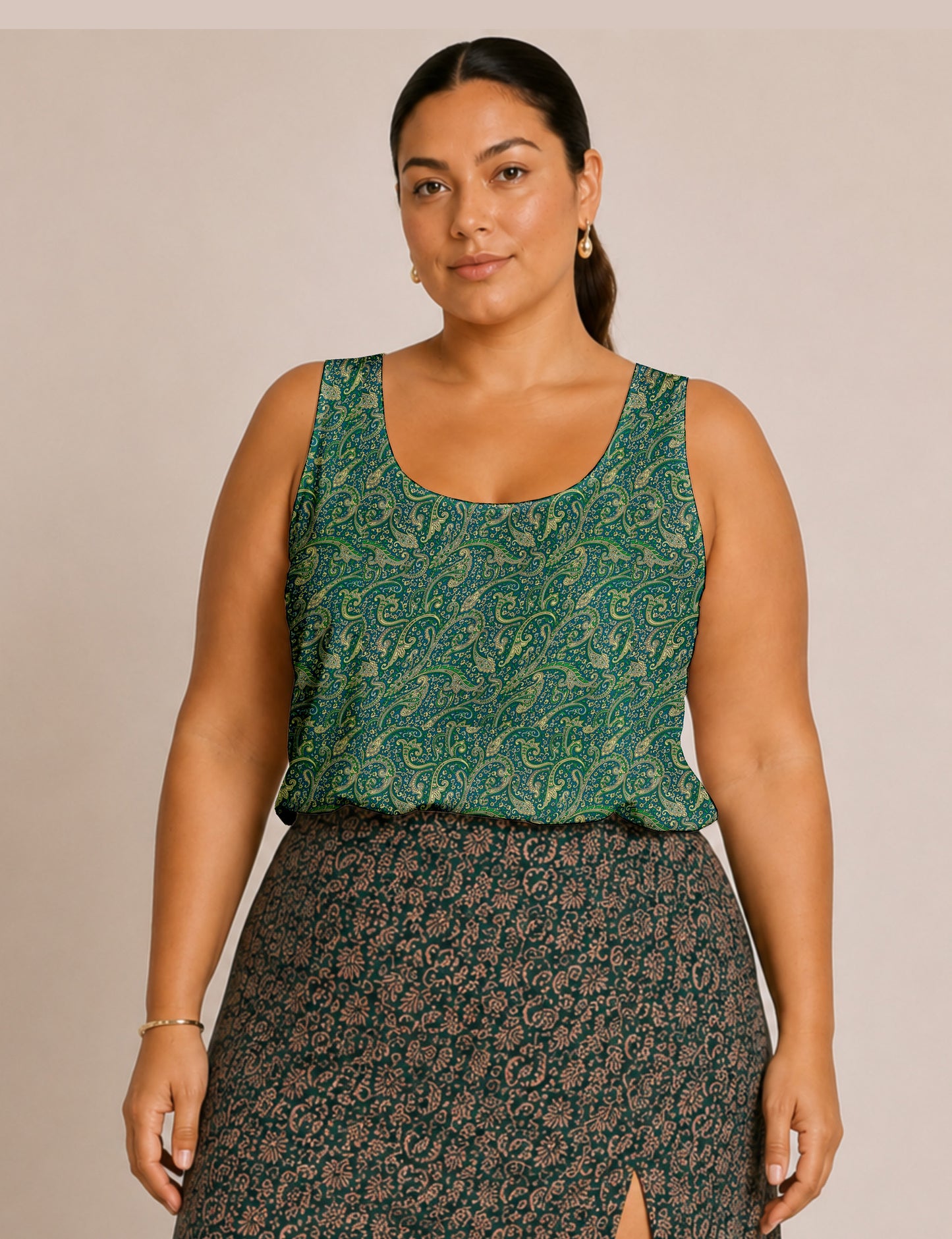 Women's sleeveless blouse with a relaxed straight fit, wide scoop neckline, deep scoop back, and hip-length silhouette.