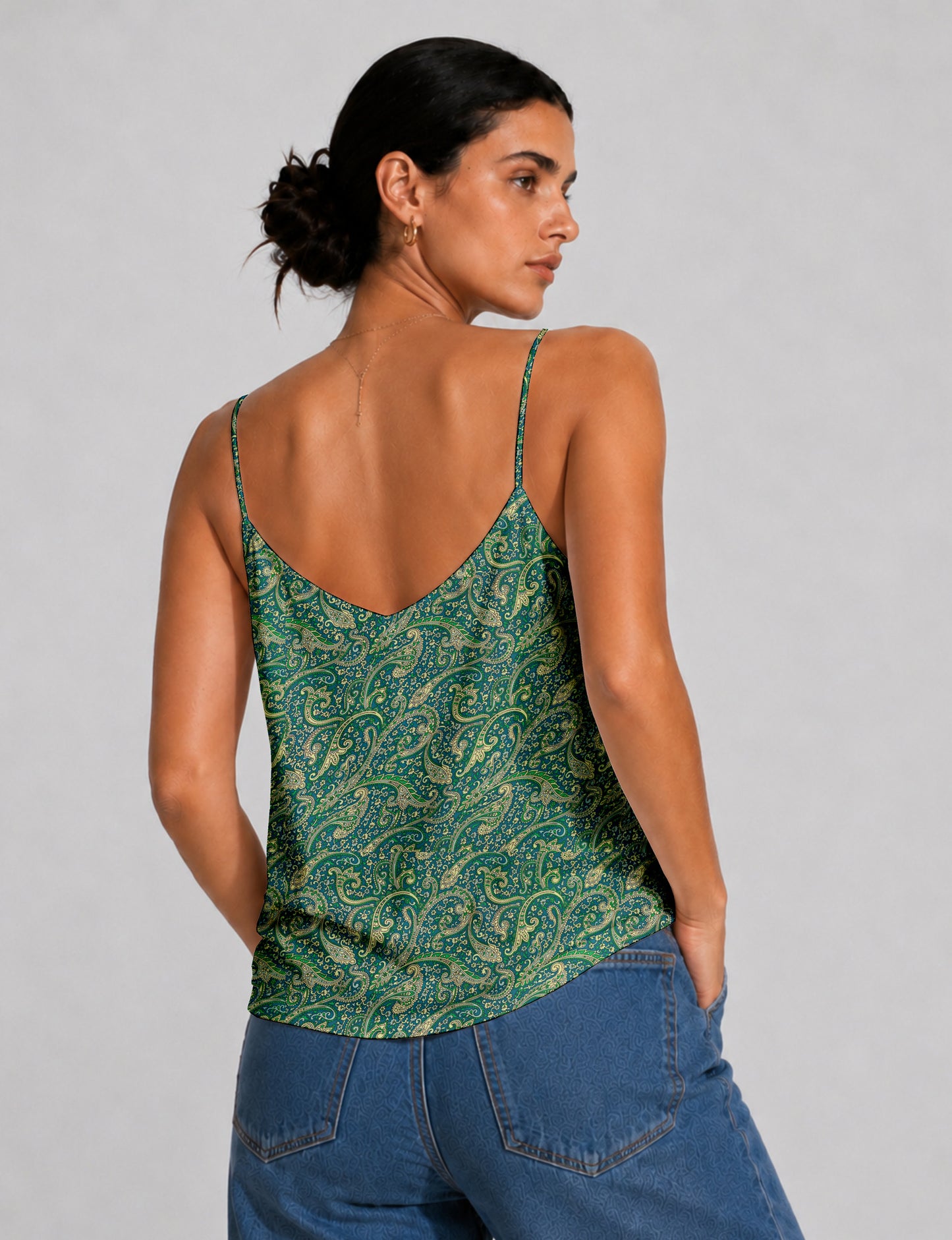 Women's sleeveless slip top with a relaxed straight fit, soft V-neckline, deep V-back, and delicate spaghetti straps.
