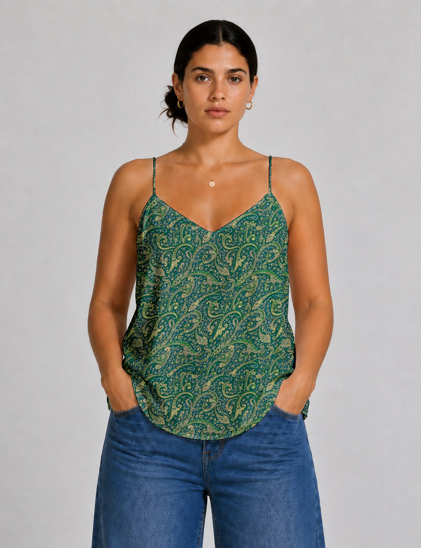 Women's sleeveless slip top with a relaxed straight fit, soft V-neckline, deep V-back, and delicate spaghetti straps.