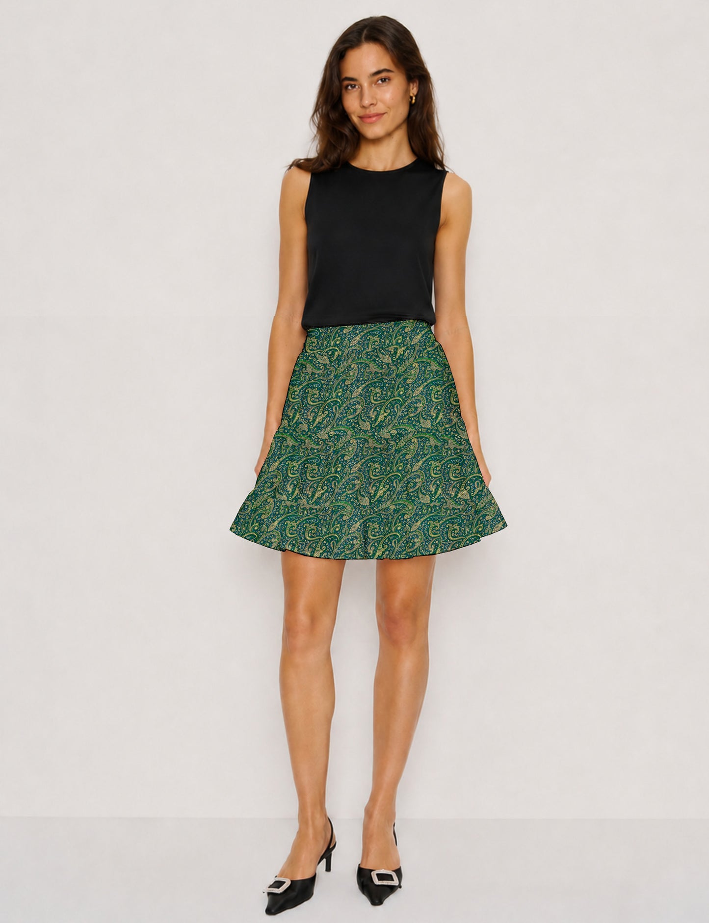 Short tiered skirt with a fitted waistband, knife pleats, softly flared silhouette, side seam pockets, and above-the-knee length.
