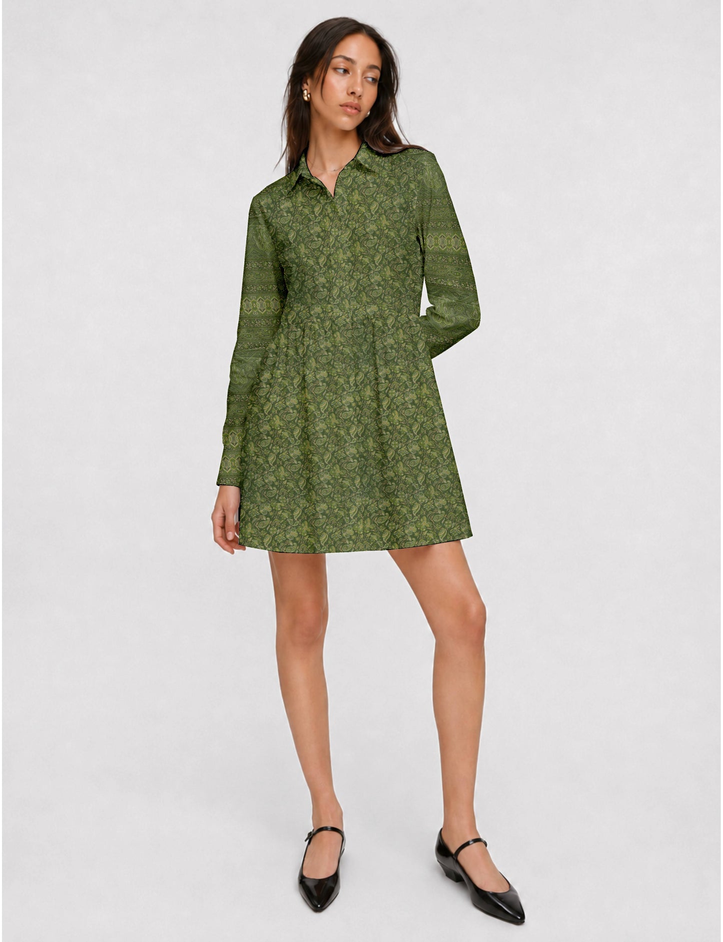 Short shirt dress with a relaxed A-line silhouette, point collar, partial button placket, gathered waist, side pockets, and full-length cuffed sleeves.