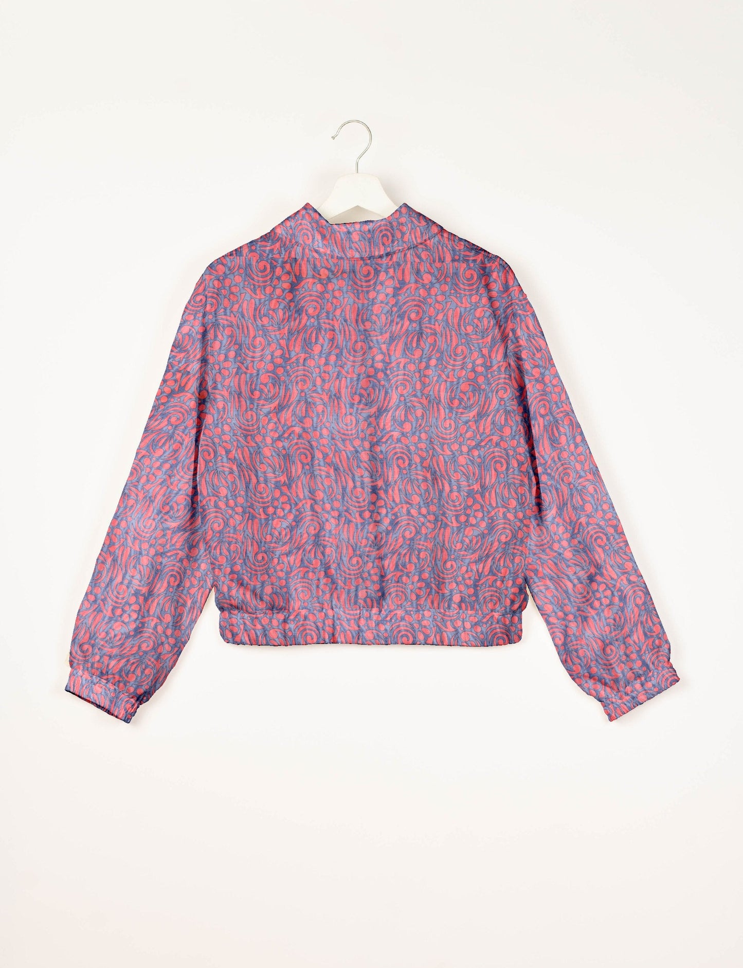 Upcycled Bomber Jacket made from recycled sari materials, featuring a cute cropped shape, elasticated hem and cuffs, and contrast sari print lining. Sustainable apparel promoting eco-friendly fashion and ethical clothing.