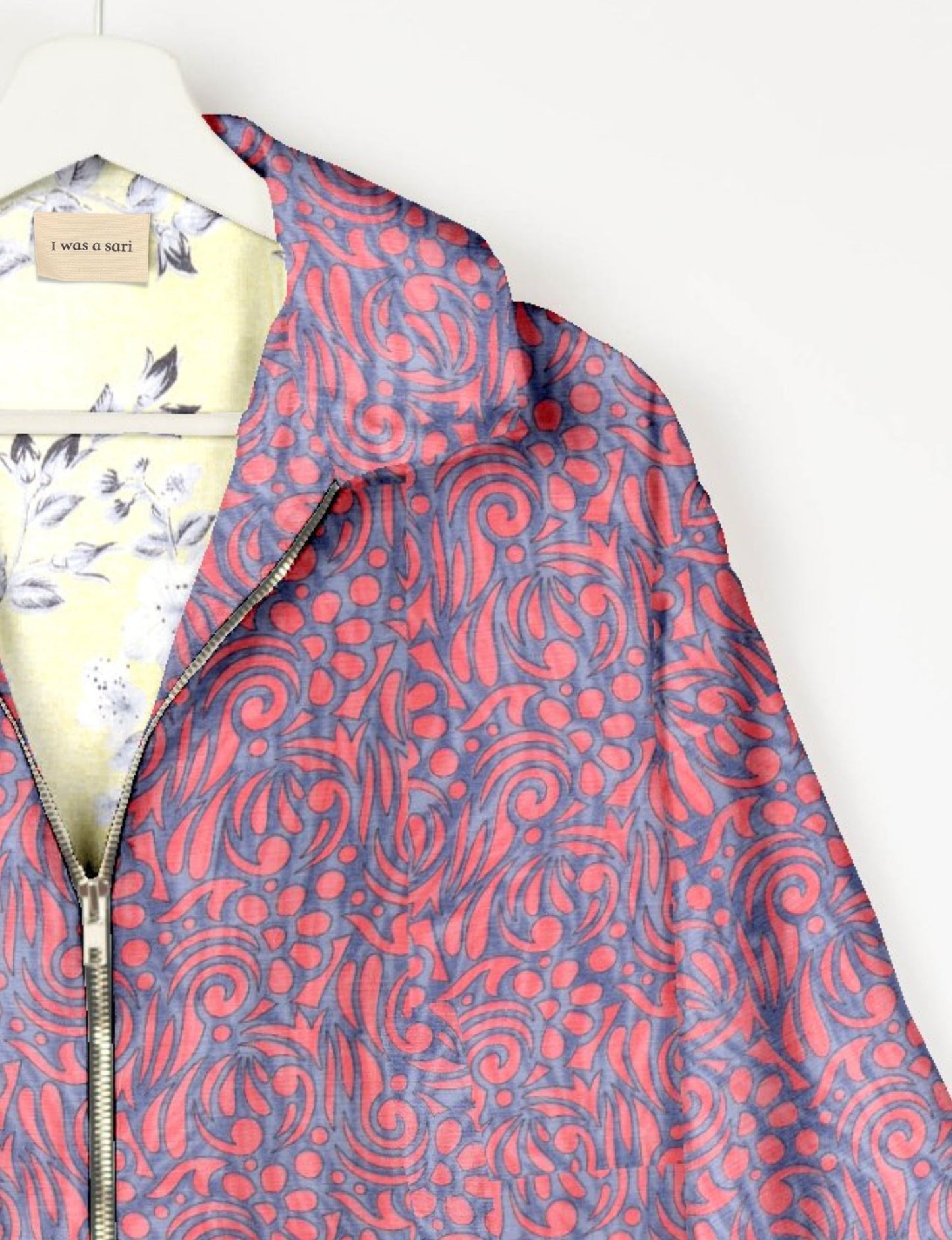 Upcycled Bomber Jacket made from recycled sari materials, featuring a cute cropped shape, elasticated hem and cuffs, and contrast sari print lining. Sustainable apparel promoting eco-friendly fashion and ethical clothing.