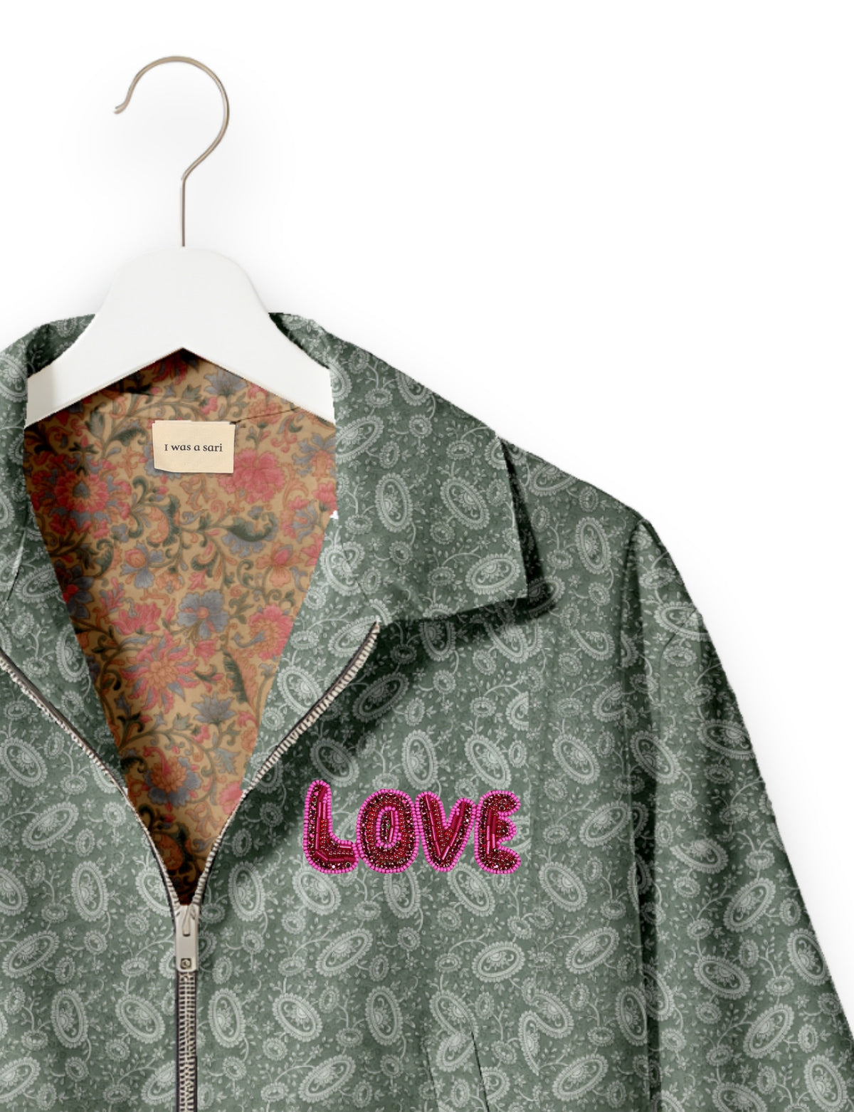 Love Bomber Jacket made from recycled fabric, featuring hand-stitched Aari embroidery. A unique piece of zero-waste clothing, part of the circular fashion movement. Designed with upcycled materials for a stylish yet environmentally friendly clothing choice.