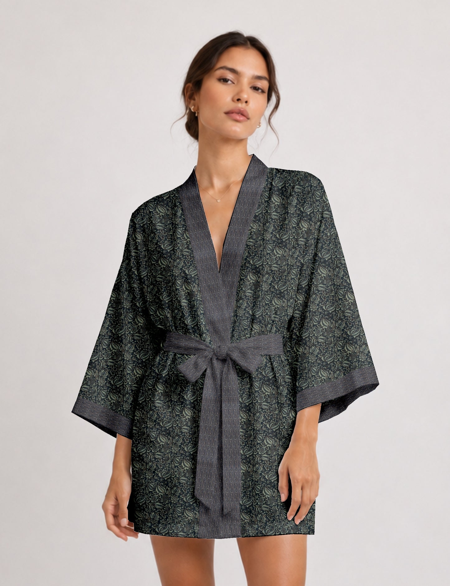 Short kimono robe with wrap front, V-neckline, wide sleeves, waist tie, and concealed skort detail.