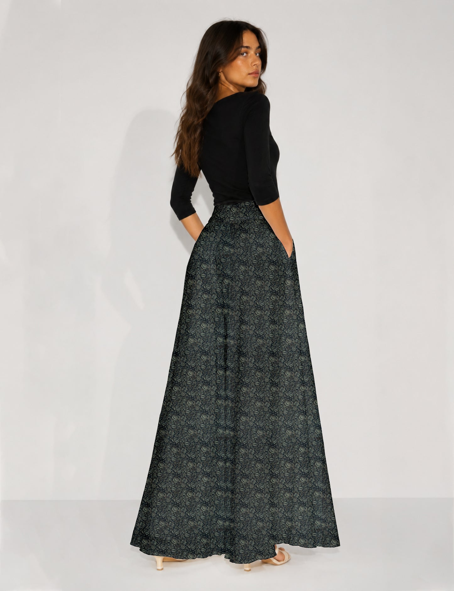 Blue wide leg palazzo trousers with a small tropical floral pattern, flat lay front view
