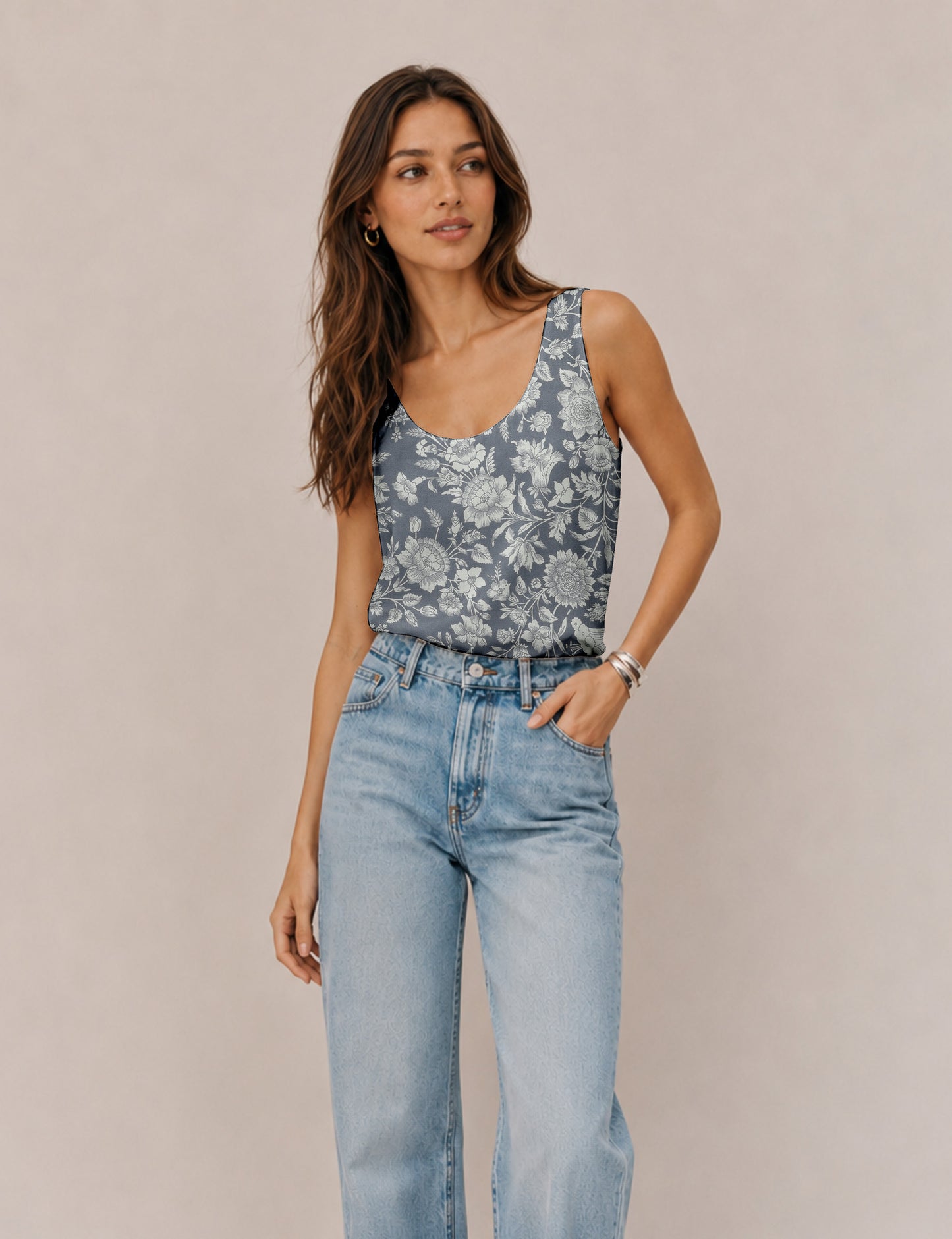 Women's sleeveless blouse with a relaxed straight fit, wide scoop neckline, deep scoop back, and hip-length silhouette.