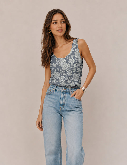 Women's sleeveless blouse with a relaxed straight fit, wide scoop neckline, deep scoop back, and hip-length silhouette.