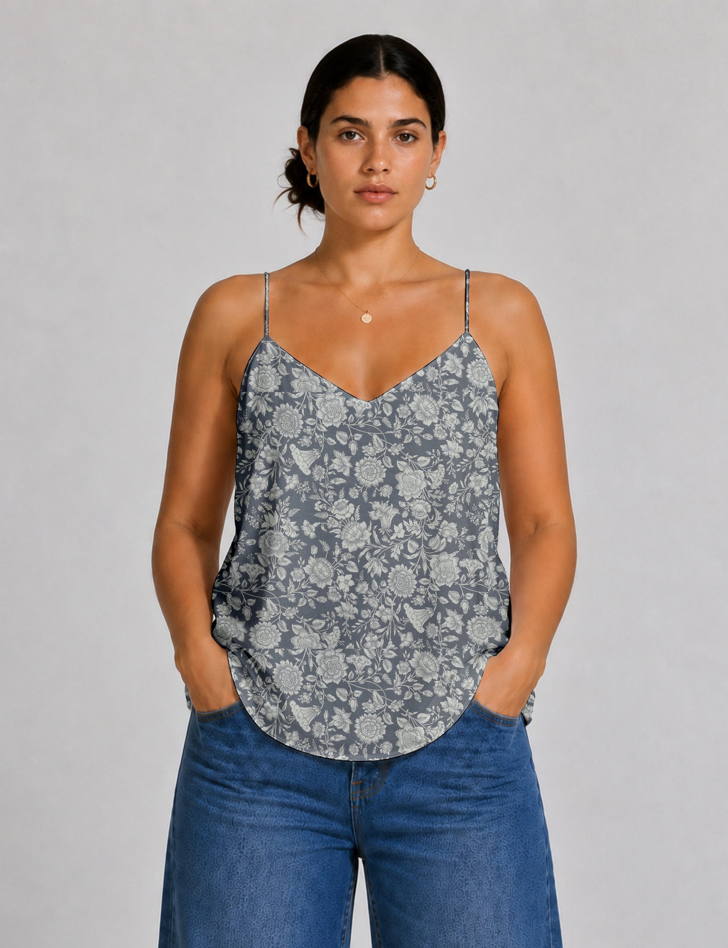 Women's sleeveless slip top with a relaxed straight fit, soft V-neckline, deep V-back, and delicate spaghetti straps.