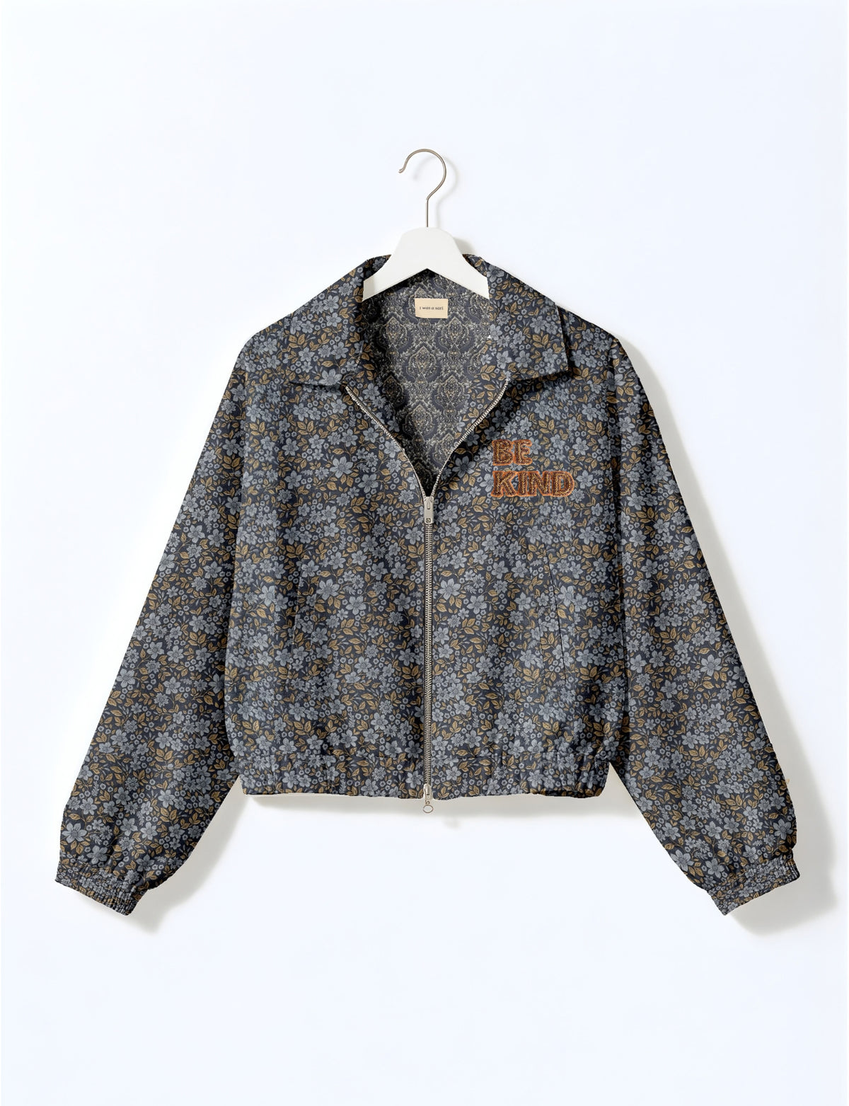 BE KIND Bomber jacket made from upcycled sari fabric with handcrafted Aari embroidery by female artisans.