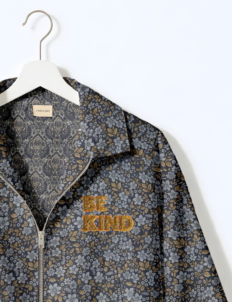 BE KIND Bomber jacket made from upcycled sari fabric with handcrafted Aari embroidery by female artisans.