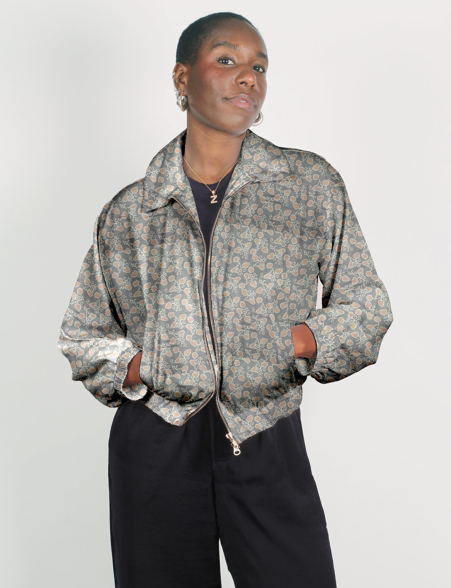 Upcycled Bomber Jacket made from recycled sari materials, featuring a cute cropped shape, elasticated hem and cuffs, and contrast sari print lining. Sustainable apparel promoting eco-friendly fashion and ethical clothing.