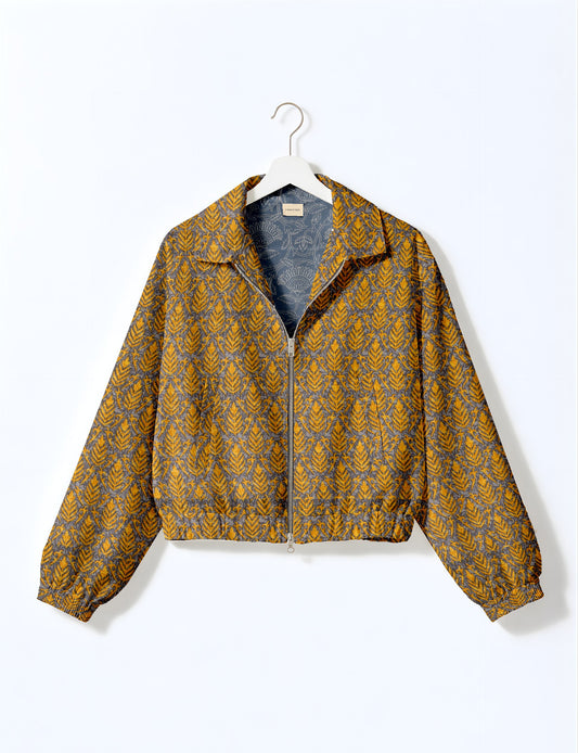 Upcycled Bomber Jacket made from recycled sari materials, featuring a cute cropped shape, elasticated hem and cuffs, and contrast sari print lining. Sustainable apparel promoting eco-friendly fashion and ethical clothing.