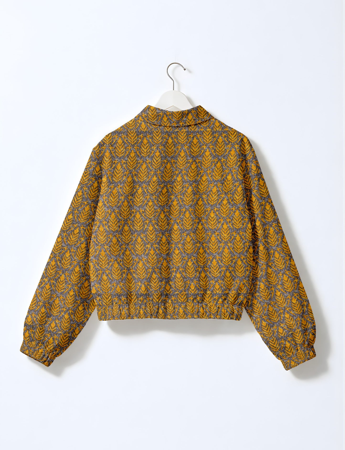 Upcycled Bomber Jacket made from recycled sari materials, featuring a cute cropped shape, elasticated hem and cuffs, and contrast sari print lining. Sustainable apparel promoting eco-friendly fashion and ethical clothing.