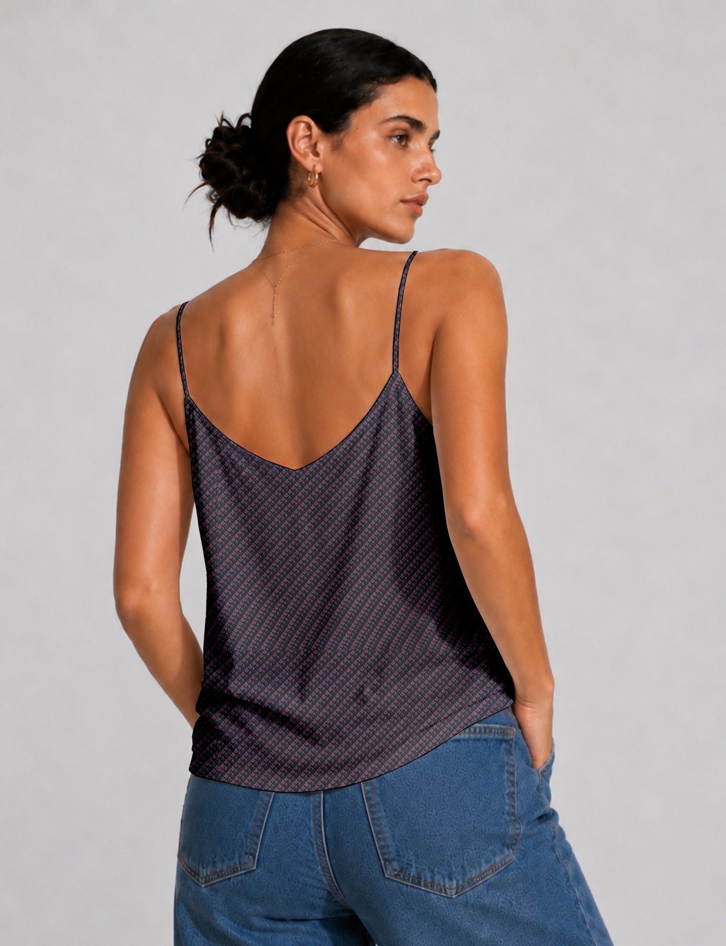Women's sleeveless slip top with a relaxed straight fit, soft V-neckline, deep V-back, and delicate spaghetti straps.