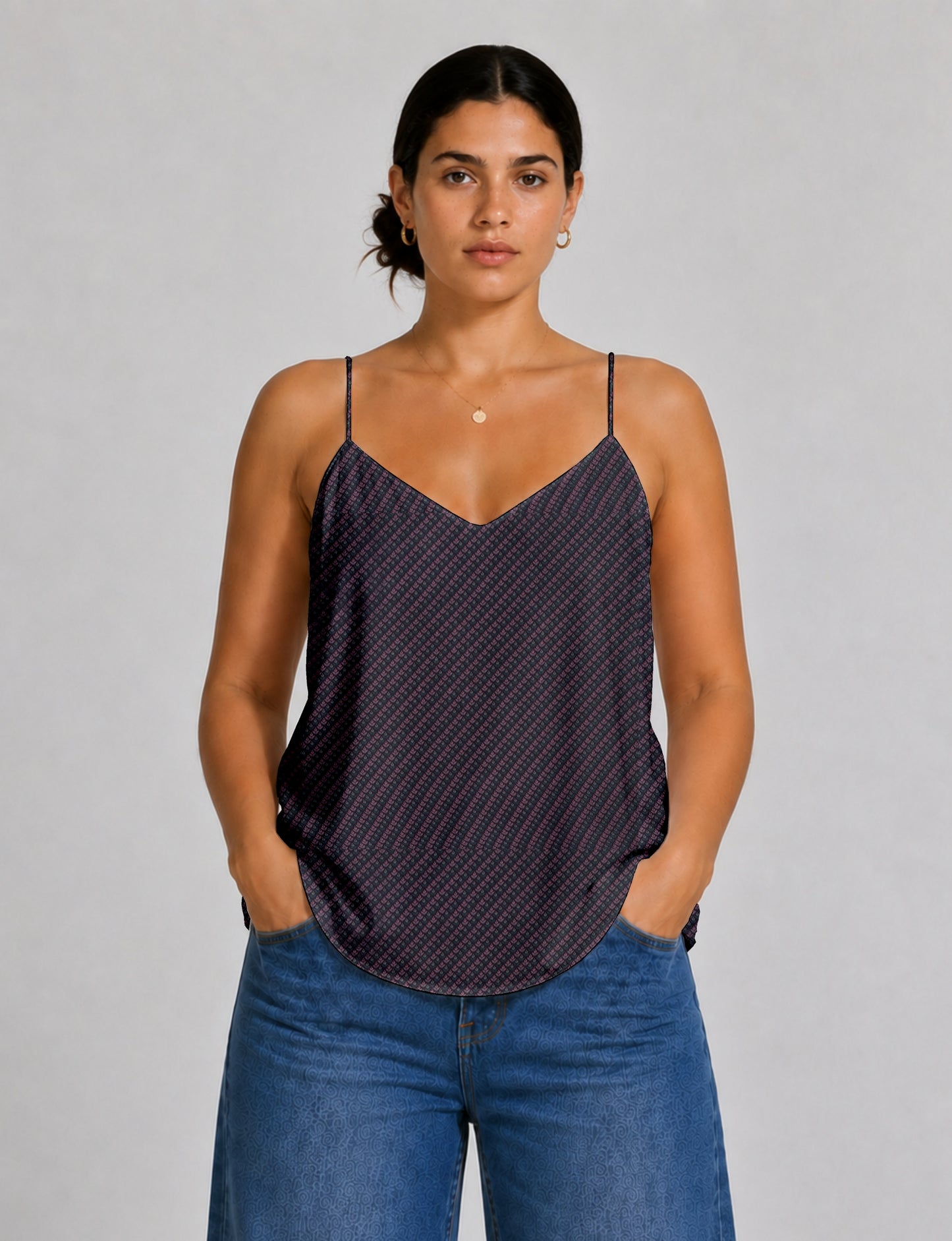 Women's sleeveless slip top with a relaxed straight fit, soft V-neckline, deep V-back, and delicate spaghetti straps.