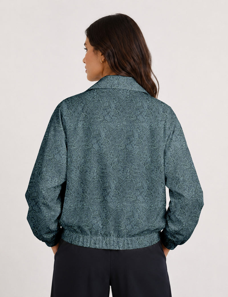 Brown floral bomber jacket with front zipper, elastic cuffs and hem, hanging on white hanger, red floral inner lining visible