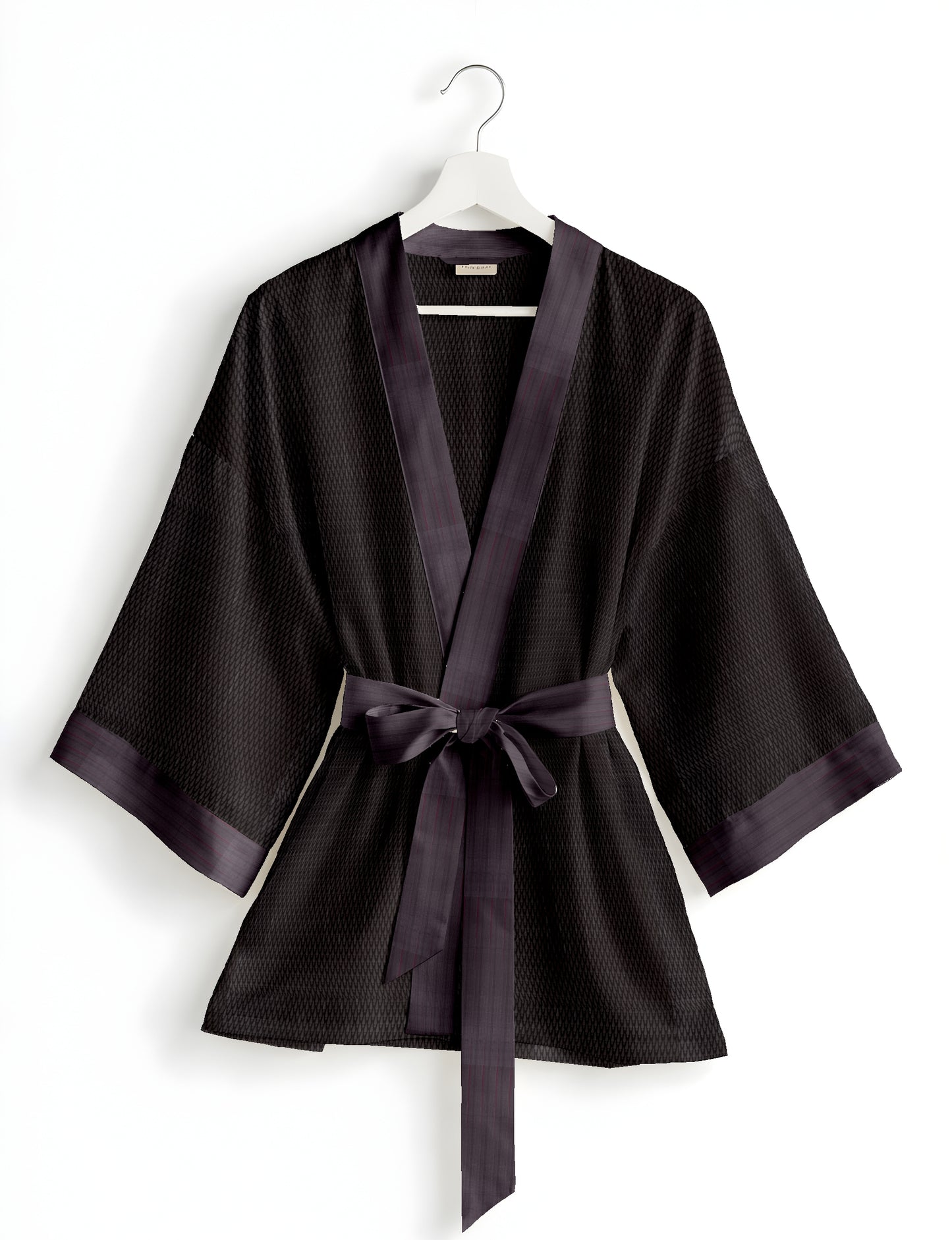 Short kimono robe with wrap front, V-neckline, wide sleeves, waist tie, and concealed skort detail.