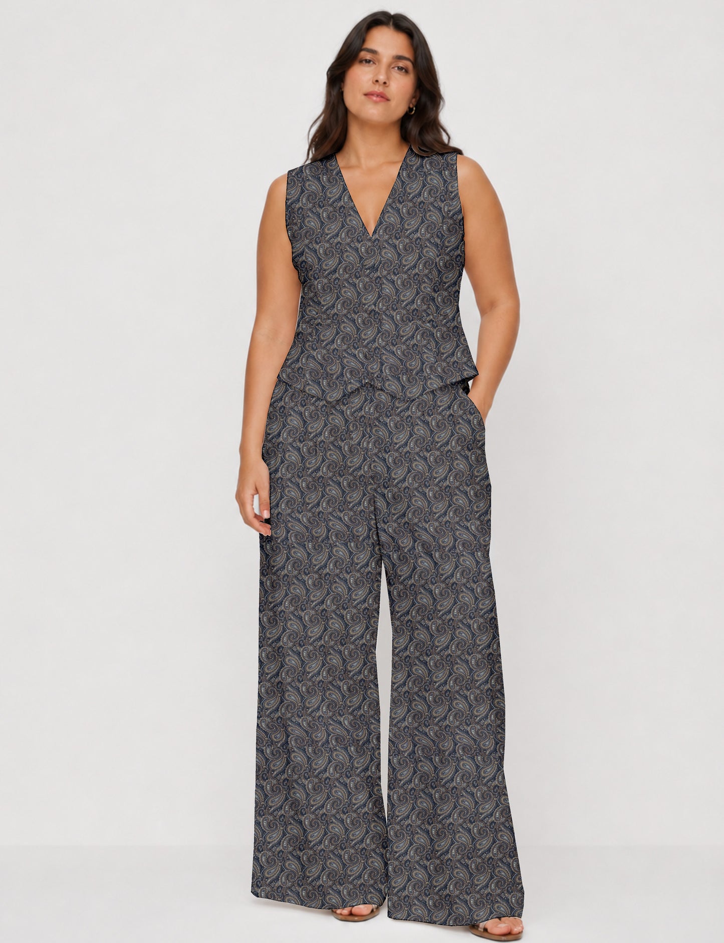 Women's tailored waistcoat set with a sleeveless V-neck button-front waistcoat and high-rise wide leg trousers in a coordinated matching outfit.