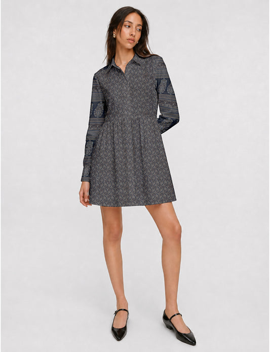 Short shirt dress with a relaxed A-line silhouette, point collar, partial button placket, gathered waist, side pockets, and full-length cuffed sleeves.