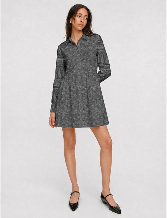 Short shirt dress with a relaxed A-line silhouette, point collar, partial button placket, gathered waist, side pockets, and full-length cuffed sleeves.