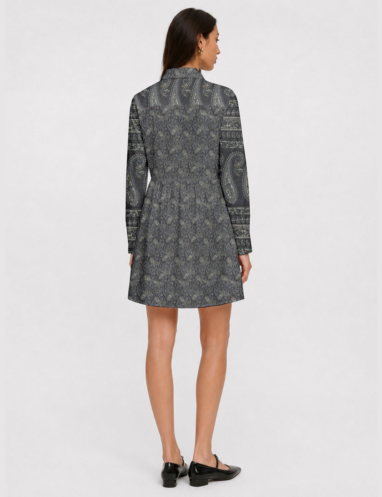 Short shirt dress with a relaxed A-line silhouette, point collar, partial button placket, gathered waist, side pockets, and full-length cuffed sleeves.