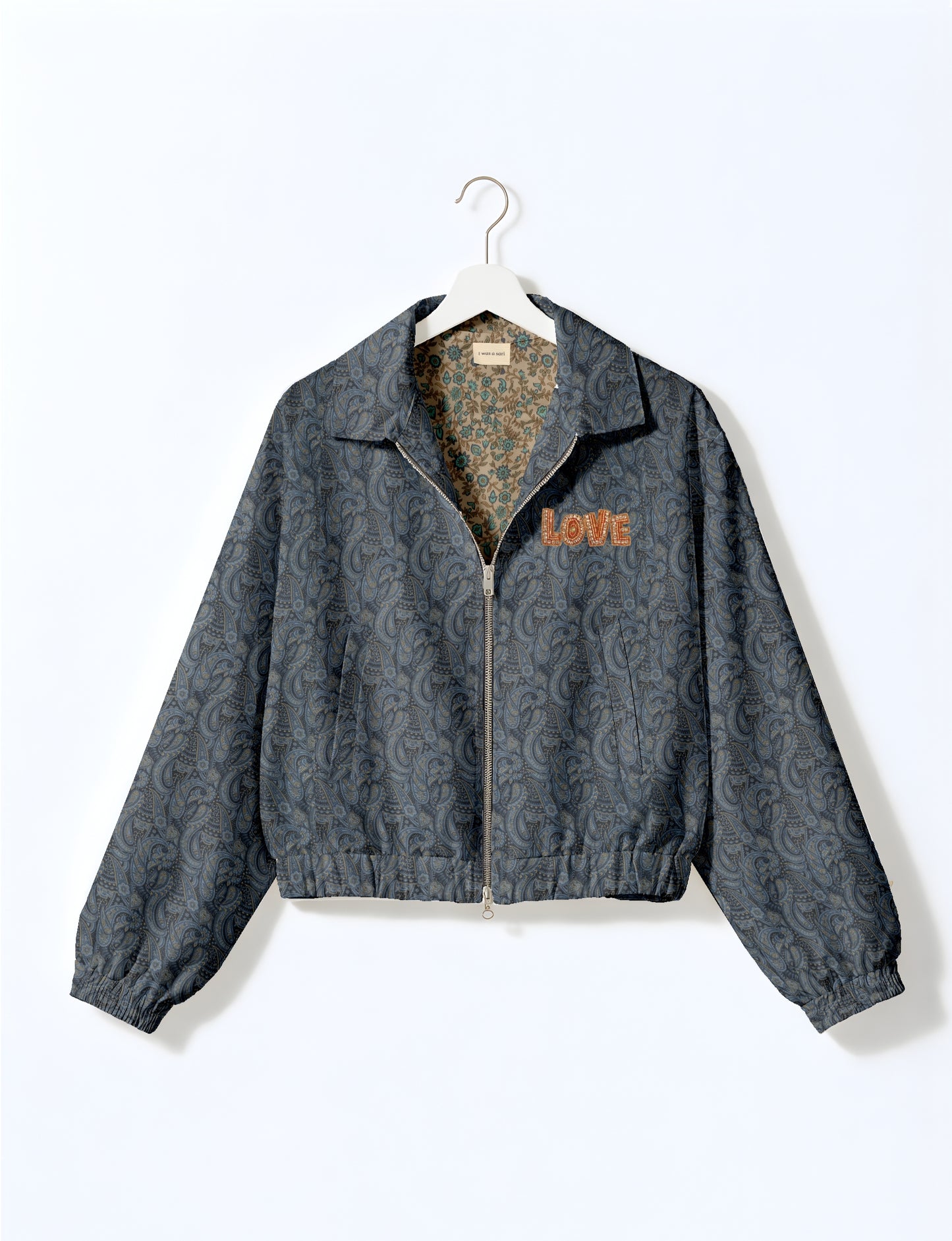 Love Bomber Jacket made from recycled fabric, featuring hand-stitched Aari embroidery. A unique piece of zero-waste clothing, part of the circular fashion movement. Designed with upcycled materials for a stylish yet environmentally friendly clothing choice.