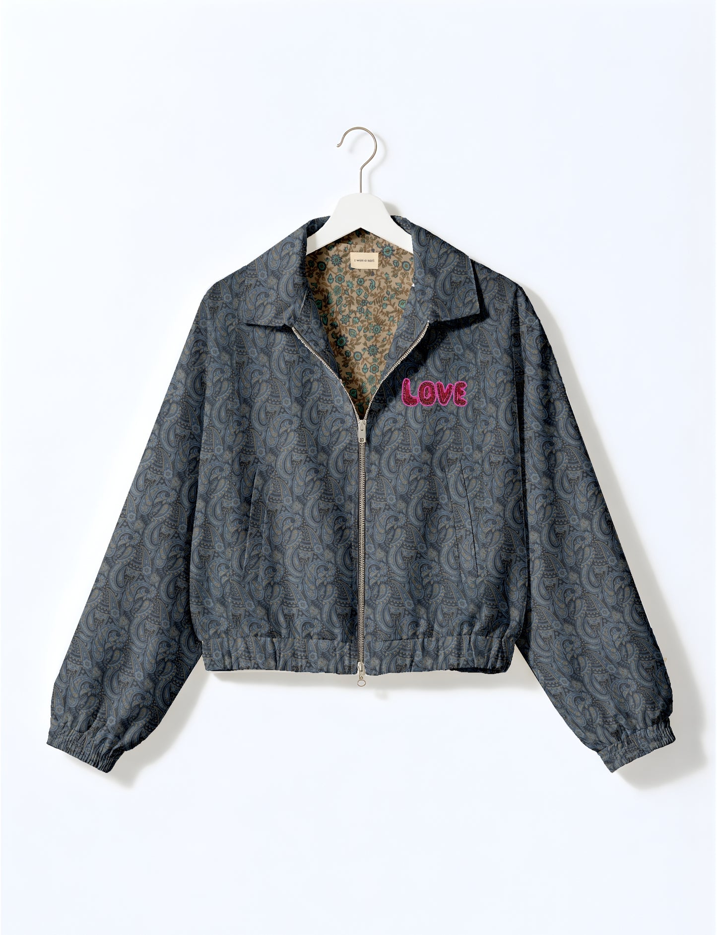 Love Bomber Jacket made from recycled fabric, featuring hand-stitched Aari embroidery. A unique piece of zero-waste clothing, part of the circular fashion movement. Designed with upcycled materials for a stylish yet environmentally friendly clothing choice.